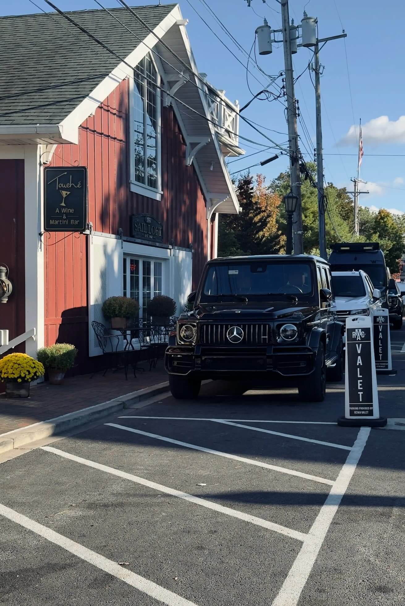 Mercedes-AMG with RCMA Valet markers along Vermilion restaurant row
