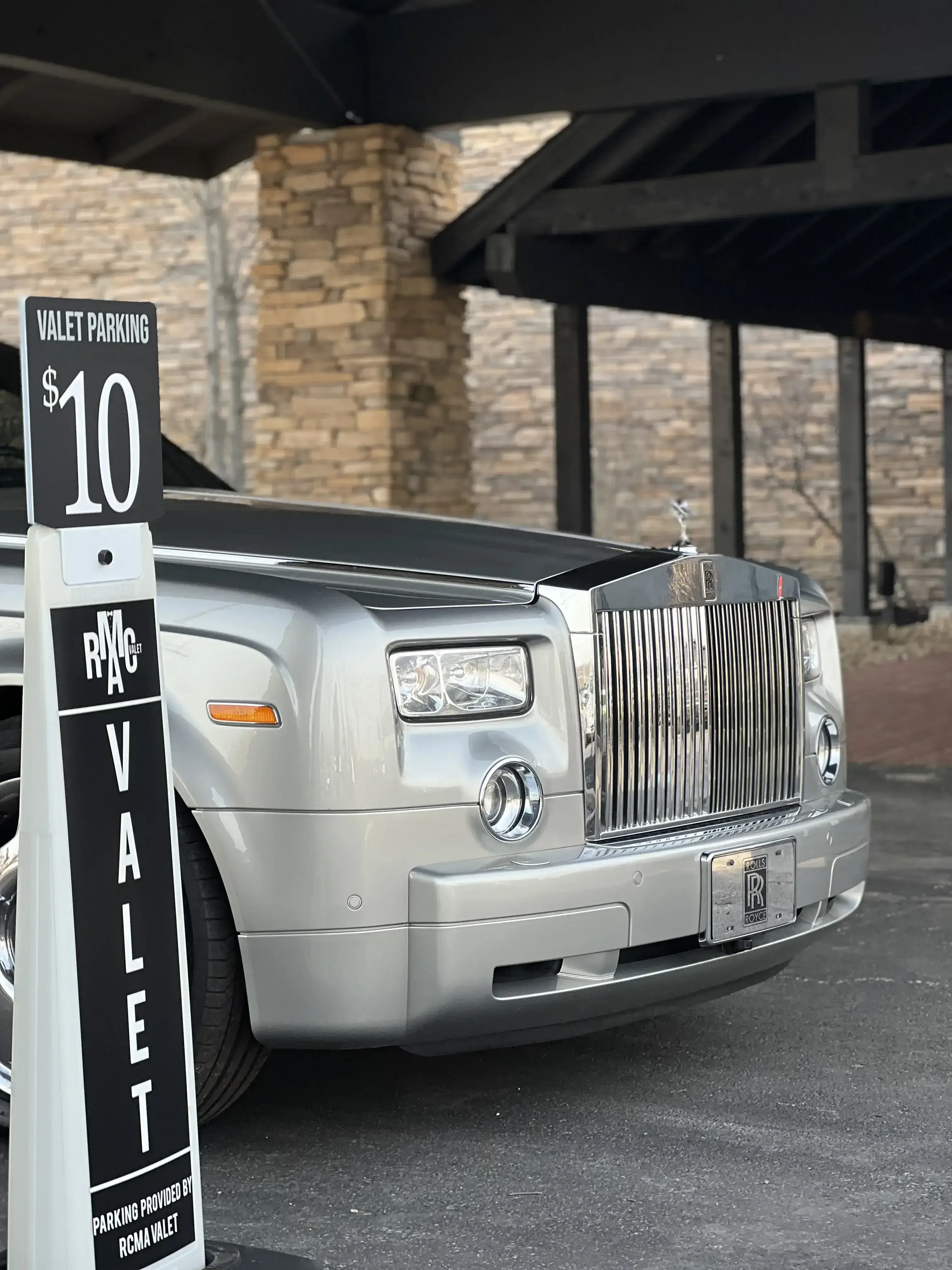 RCMA Valet $10 valet parking sign and Rolls-Royce at The Aviator Cleveland