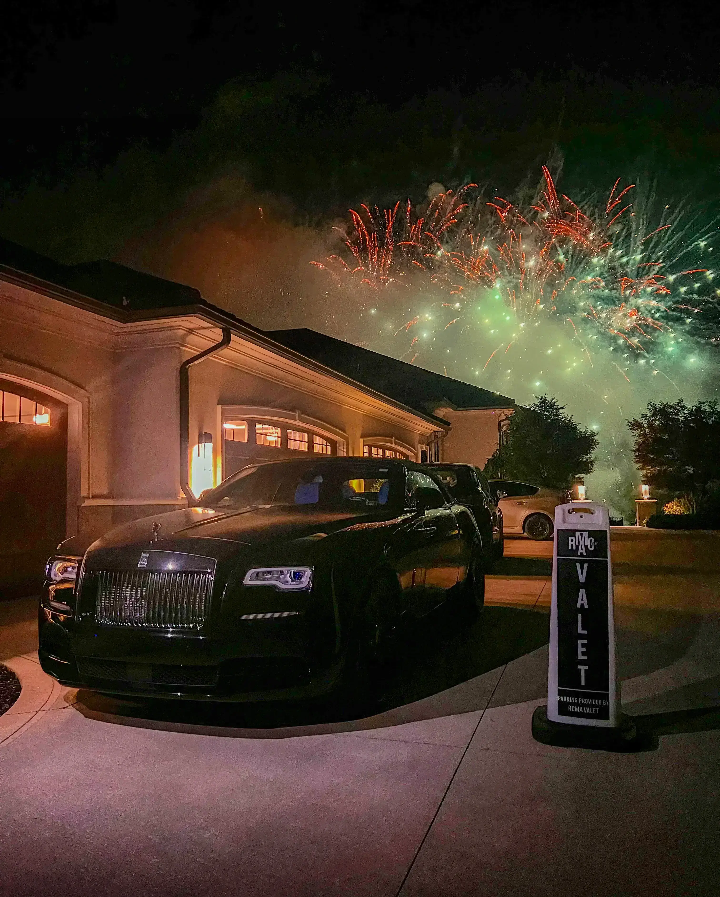 RCMA Valet stand with luxury vehicles and fireworks at a private event in Cleveland