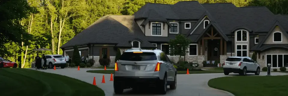 RCMA Valet stand with cars staged at a private home